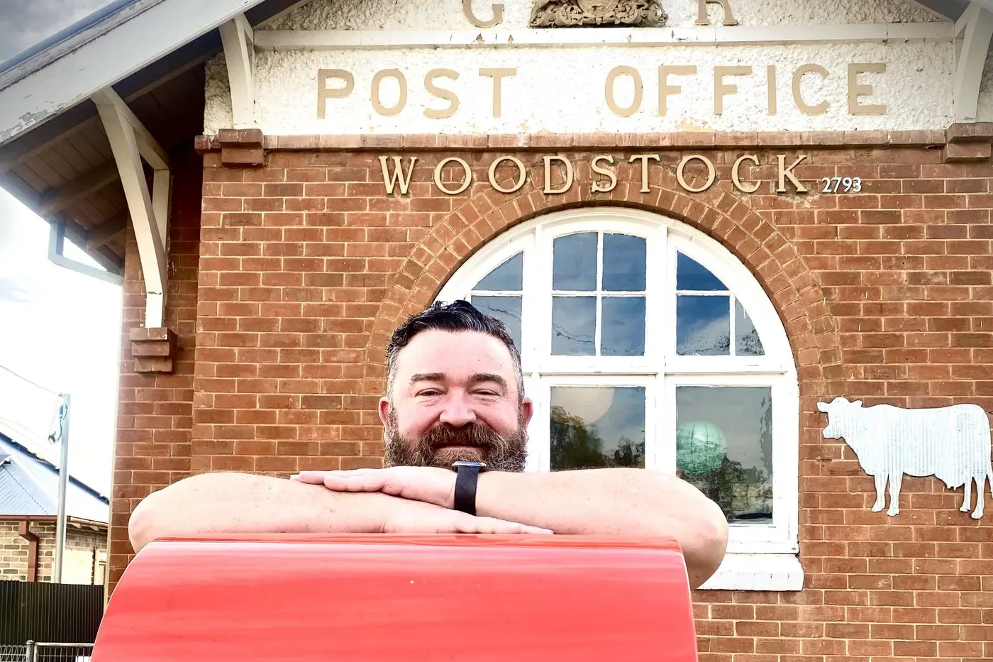 Adam Dwight at the front of the historic Woodstock Post Office he and partner, Meg Thomas, purchased on May 7.