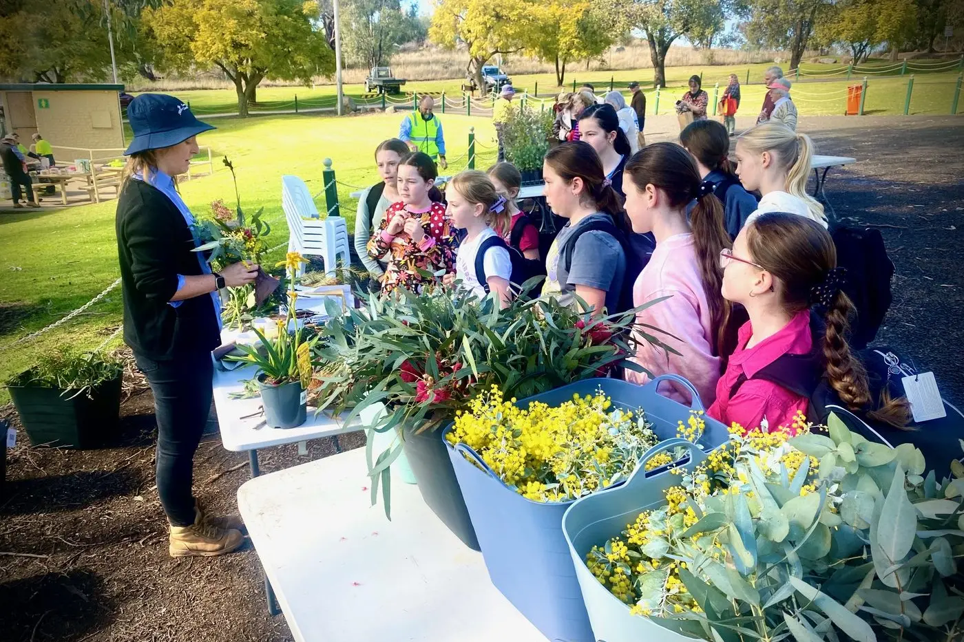 Cowra Council\\'s Pip Childs talk all things plants with local school children during National Tree Day. Photo Dane Millerd.