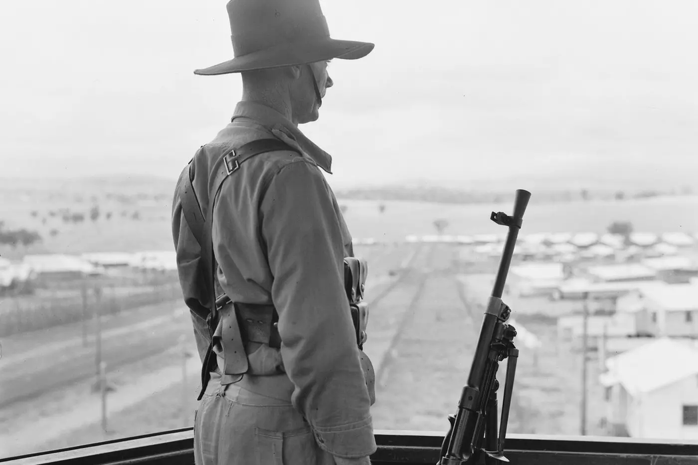 A guard on duty at the camp. Photo Australian War Memorial.