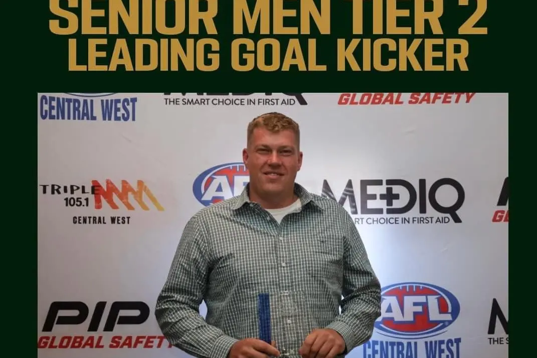SHARPSHOOTER: Cowra forward Justin Kelly with his gong for most goals. Photo courtesy of Cowra Blues.