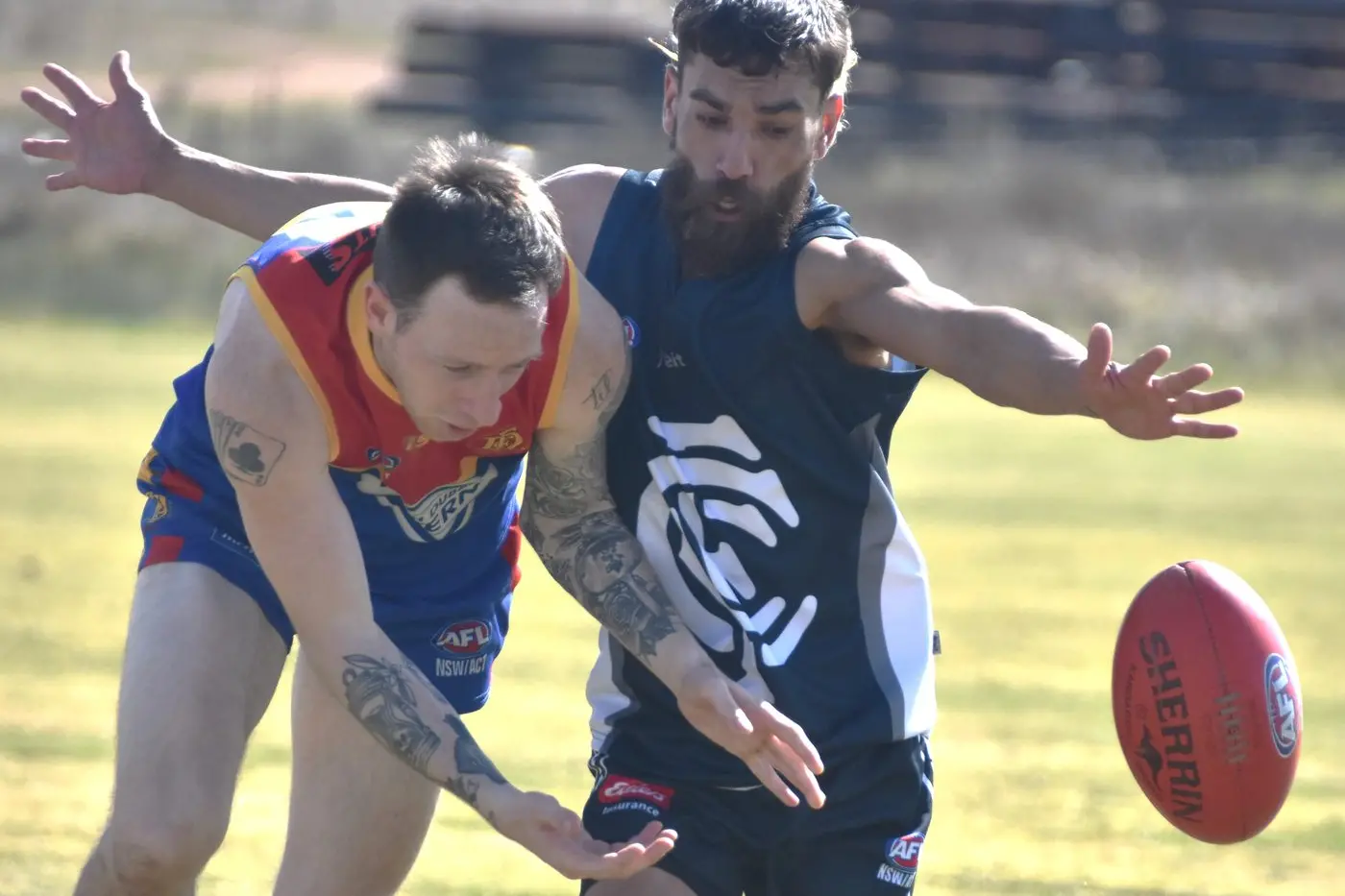 Dubbo Demon Harley Bye and Cowra\\'s Nick Collett competing for possession in Cowra\\'s win over the Demo\\'s at Geoff Day Oval last weekend.