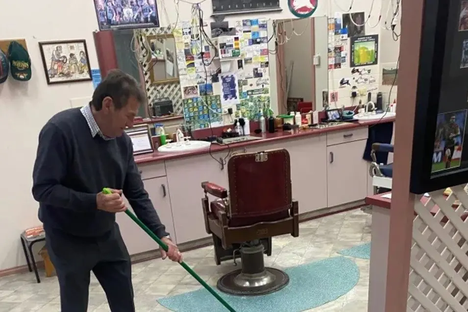 Angelo Lazarou cleaning up the mess left by criminals who went on a warpath through Calare Arcade