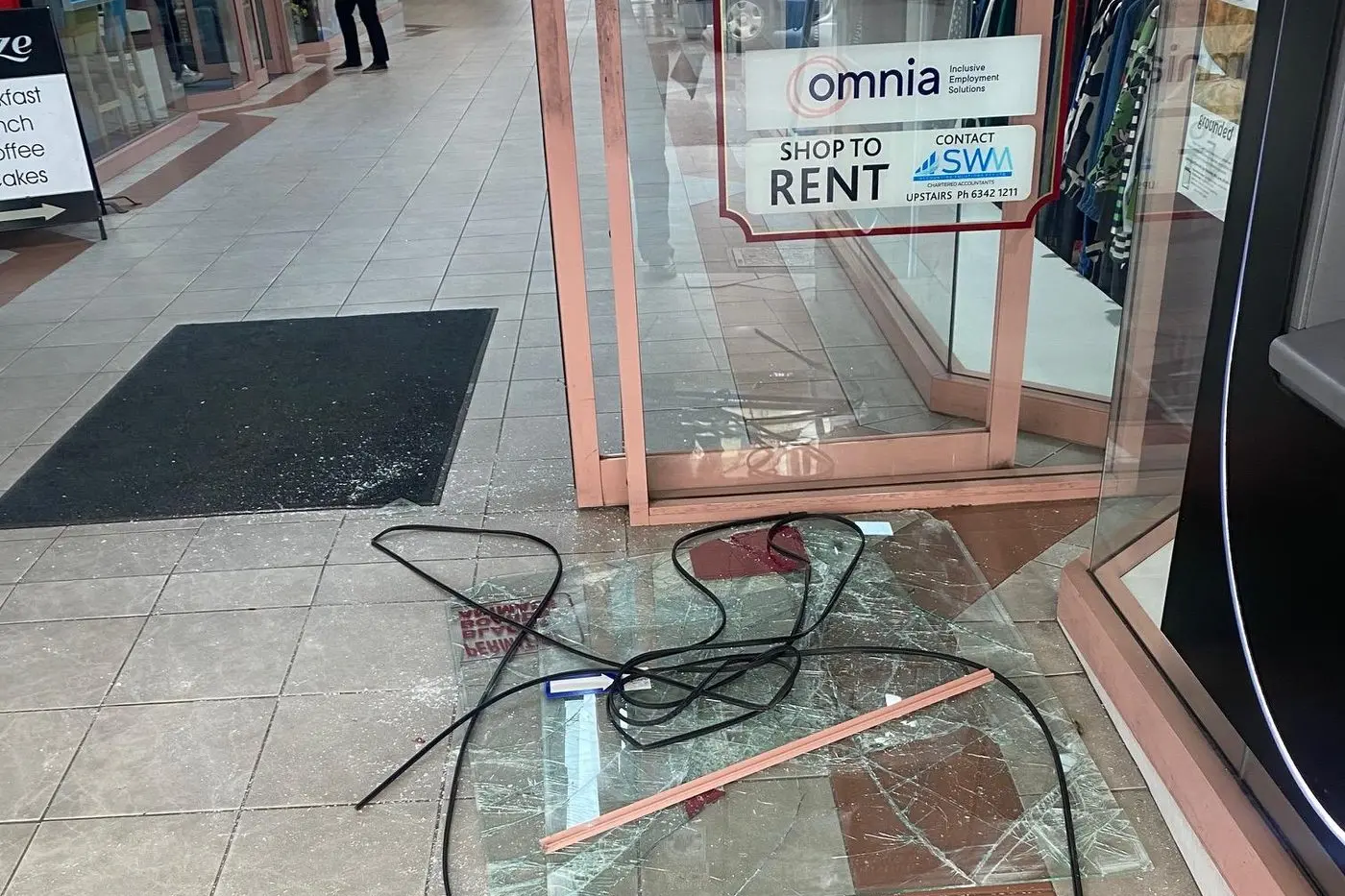 Broken glass at the entry to Cowra\\'s Centre Arcade following a recent break in.