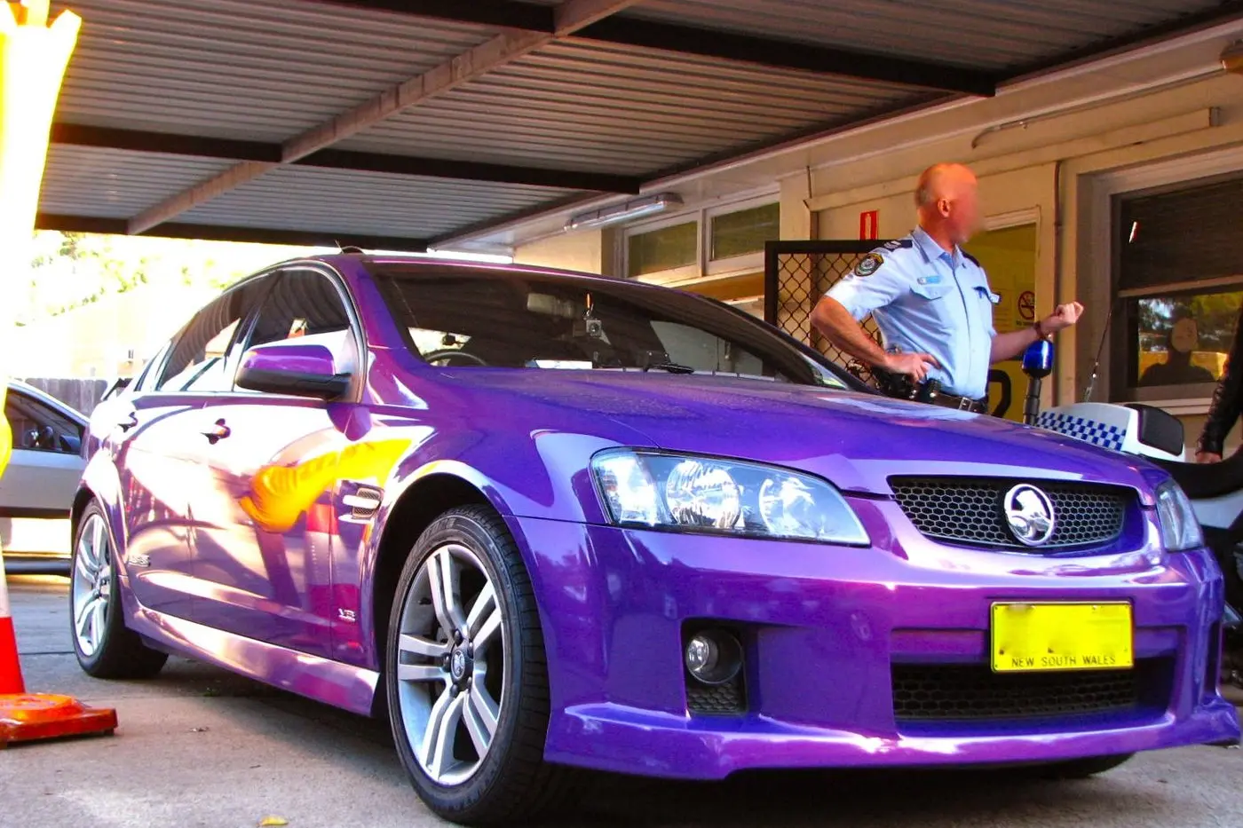 A purple Holden sedan. Image: Highway Patrol Images, Flickr