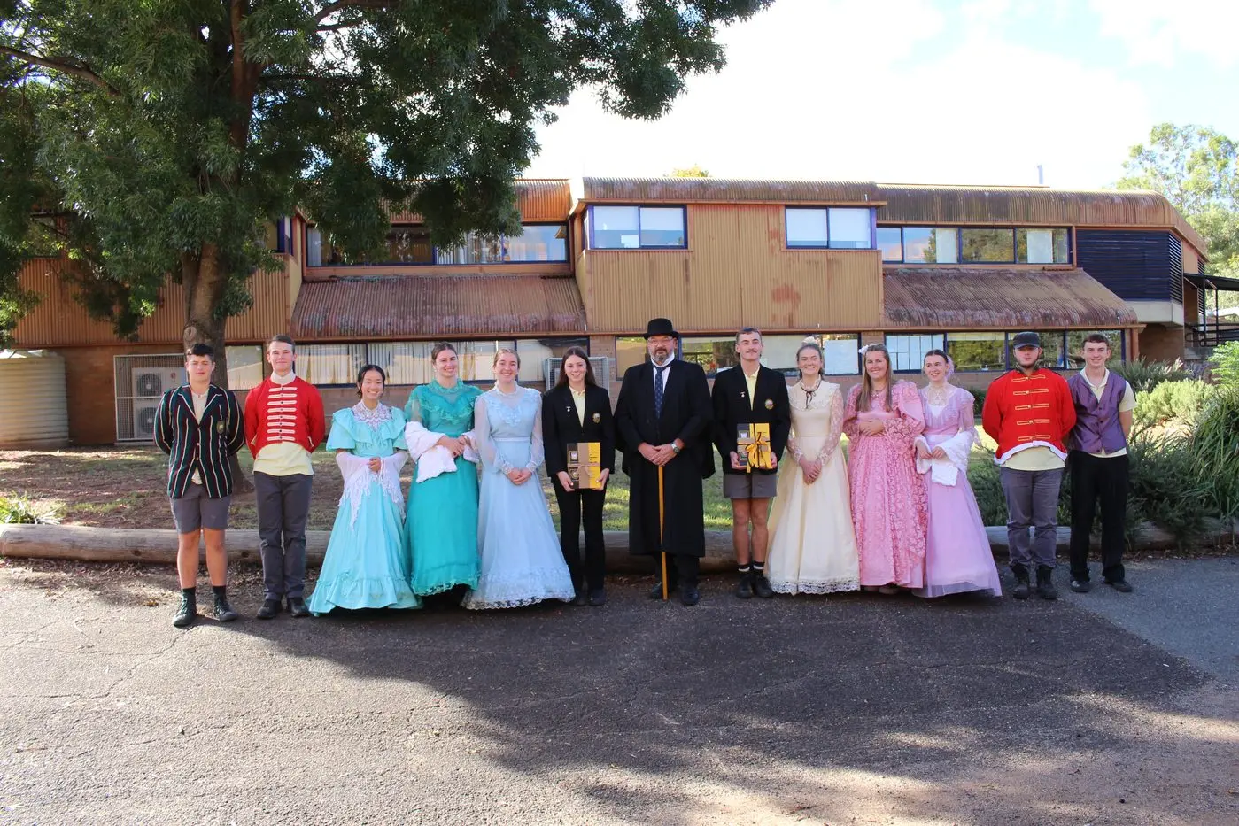 Canowindra High School  principal Brad Robinson with captains and students dressed in period uniforms who acted as ushers during the launch of the book \\'The last 50 years of Public Education in Canowindra\\'.