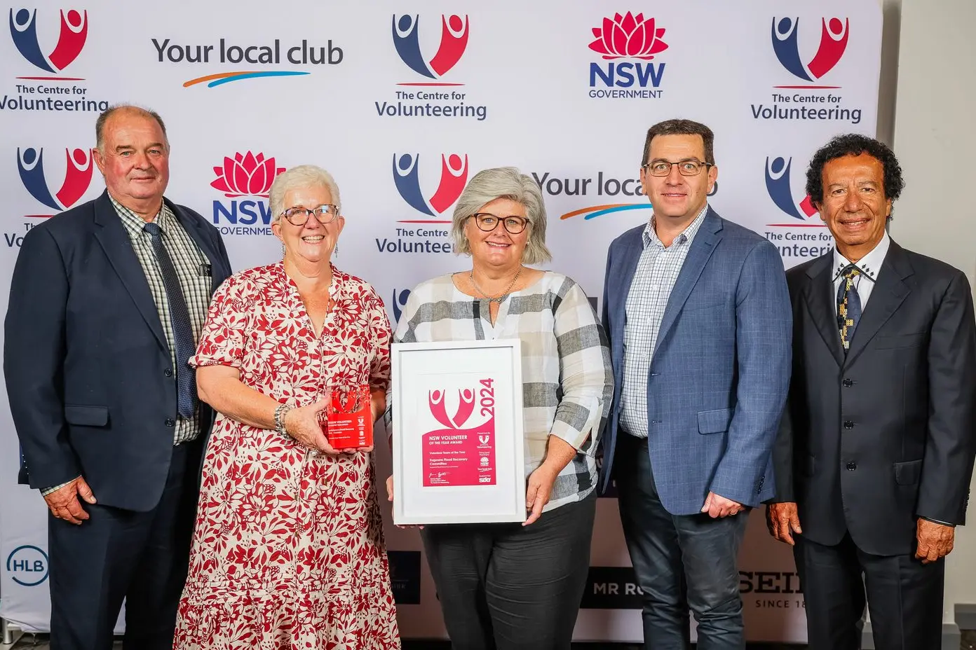 \"This is for the Eugowra community and everyone else who continues to support us.\" Eugowra flood recovery committee representatives David Herbert, Janet Moxey, Liz Mitchell and Sean Haynes accept the Centre for Volunteering Award. PHOTO: Salty Dingo