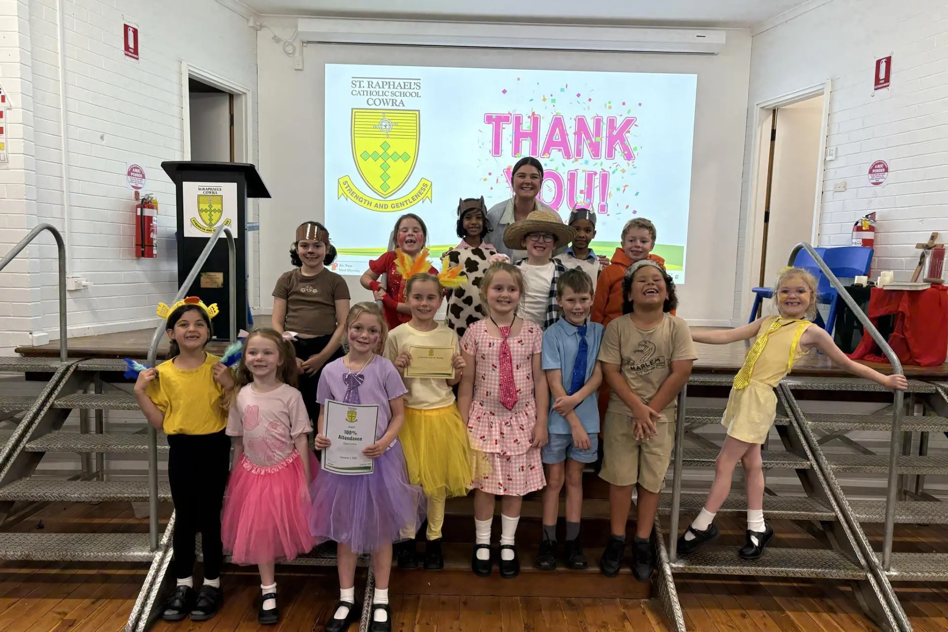 <p>Mrs Harding with her 1 Gold class at the recent K - 6 Assembly where they showcased their Auslan Adventure.</p>\\n