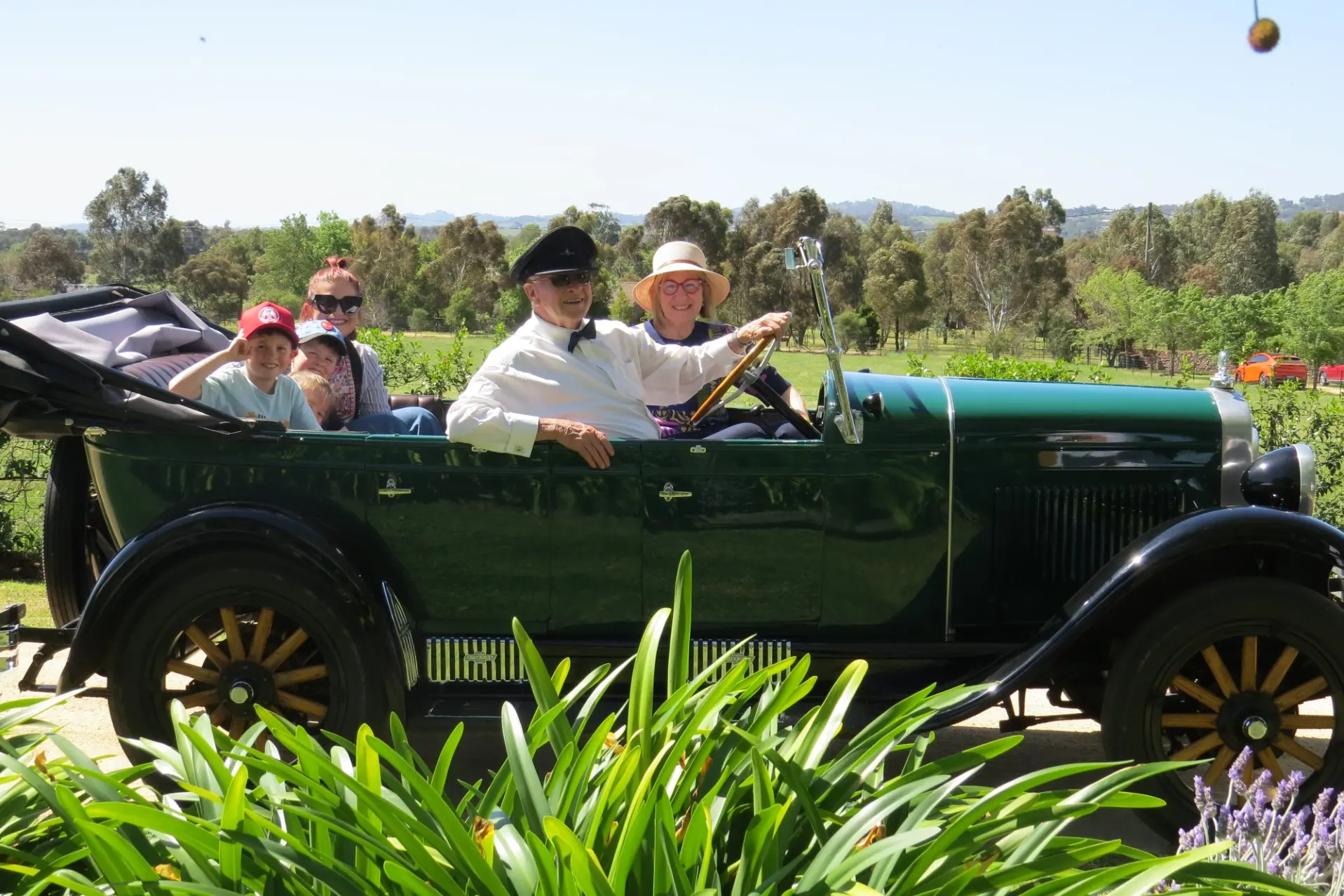 <p>Chauffeur\\u00A0Geoffrey Casey & Kaye Kilby in the front of the 1928 Chevrolet Convertible, with Lulu Kilby and her children Rhys, Geoffrey and Isabel Kilby (partially obscured) in the back.</p>\\n