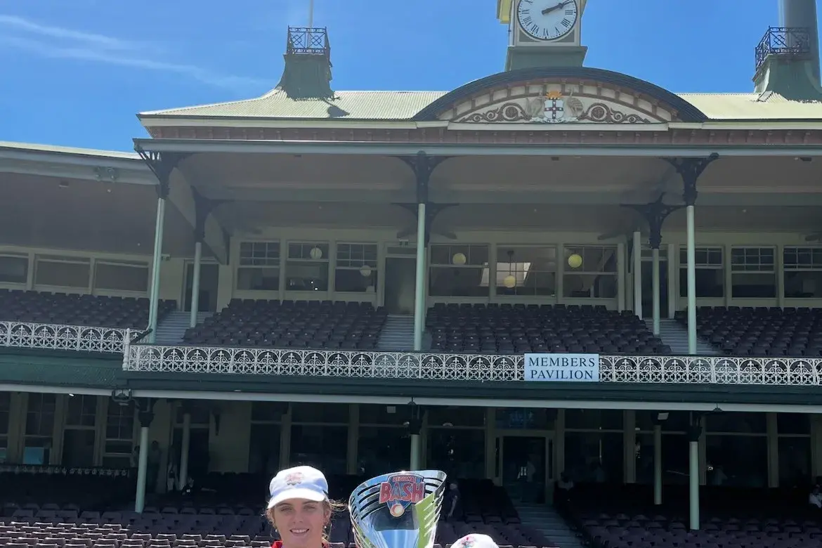 <p>Karly Woods with fellow player Emma Rippon with their Grand Final trophy.</p>\\n