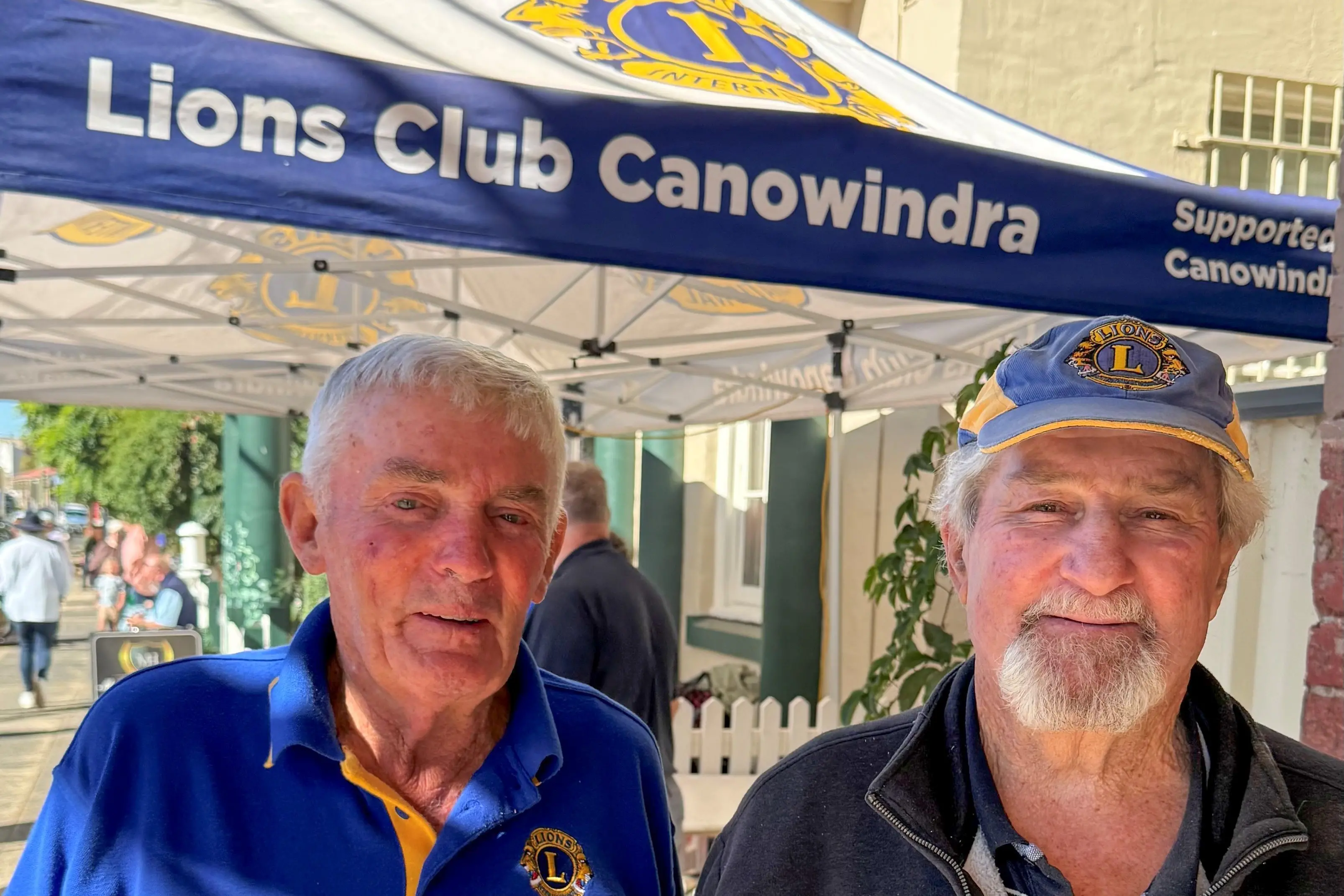 <p>Long-serving Canowindra Lions Doug Nash and Darryl Fliedner volunteering at this year\\'s balloon festival street parade.</p>\\n