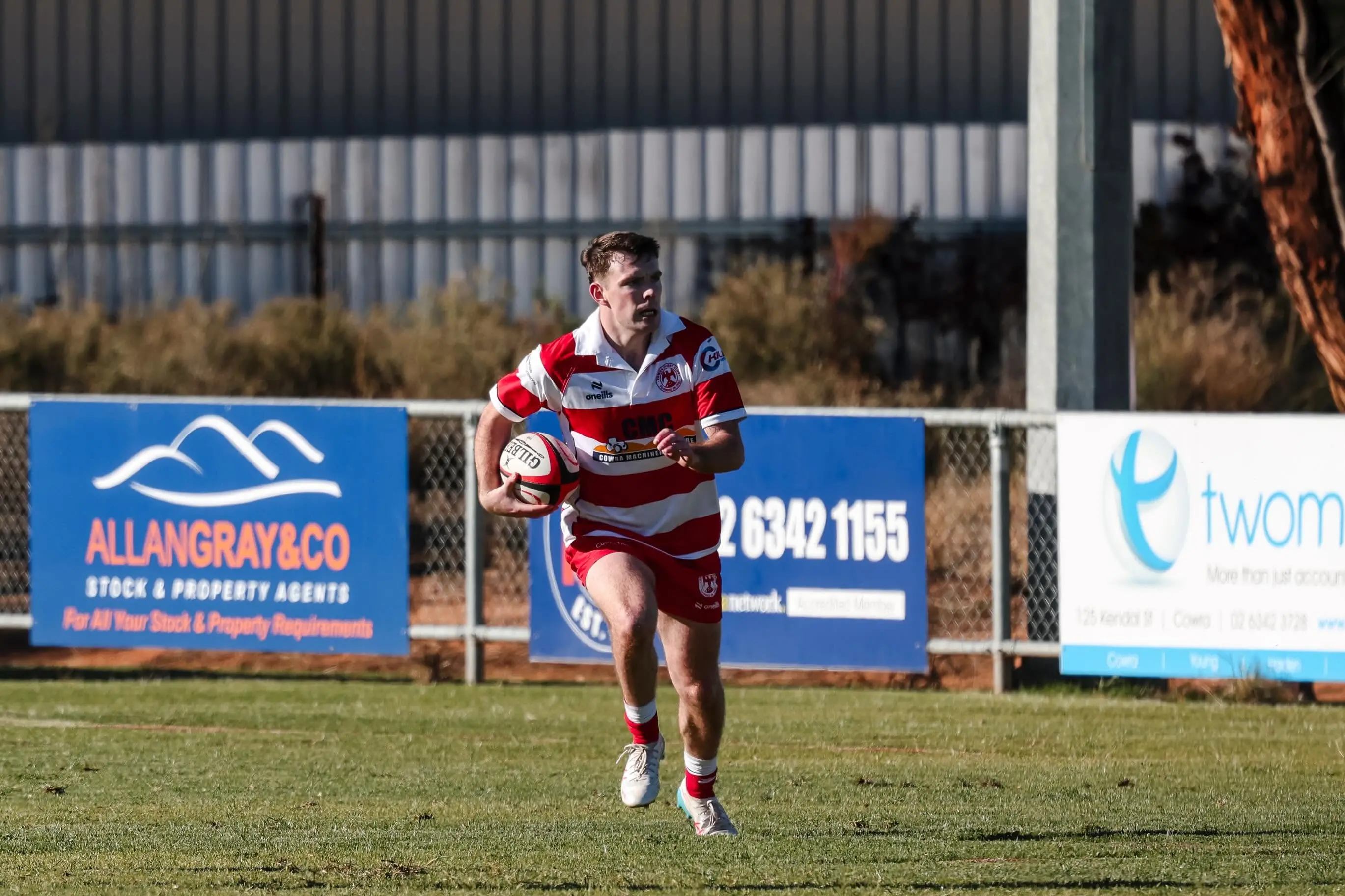 <p>James Sando running the ball towards defenders.</p>\\n