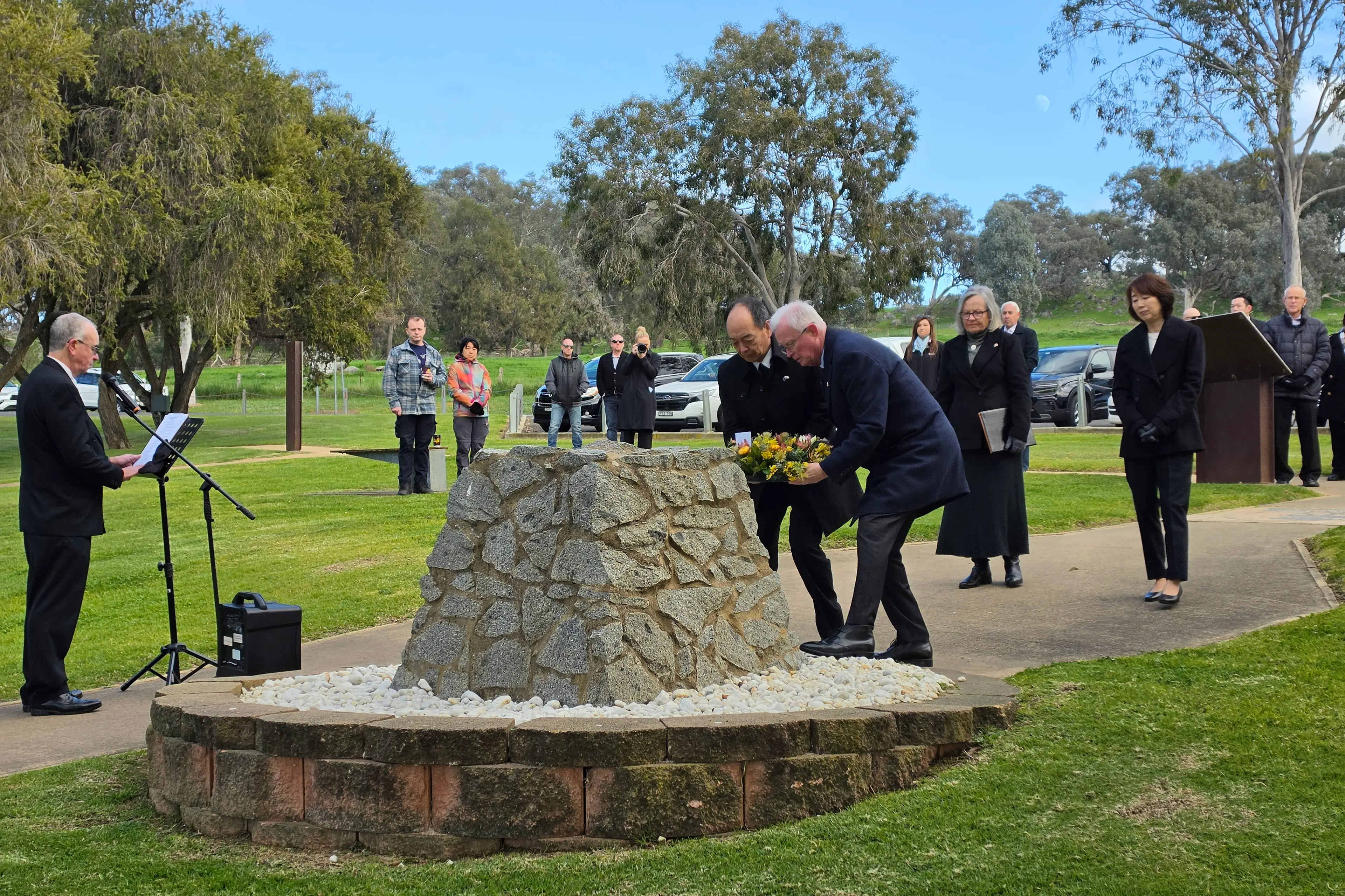 <p>Mr Osamu Yamanaka, Consul-General of Japan Sydney, Mrs Mamiko Yamanaka, Cr Paul Smith, Mayor of Cowra Shire, and Mrs Susan Smith laying a wreath. PHOTO: Simone Sheridan </p>\\n