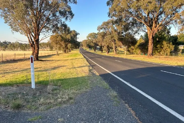 <p>View in a northern direction from existing vehicle crossing along Canowindra Road.</p>\\n
