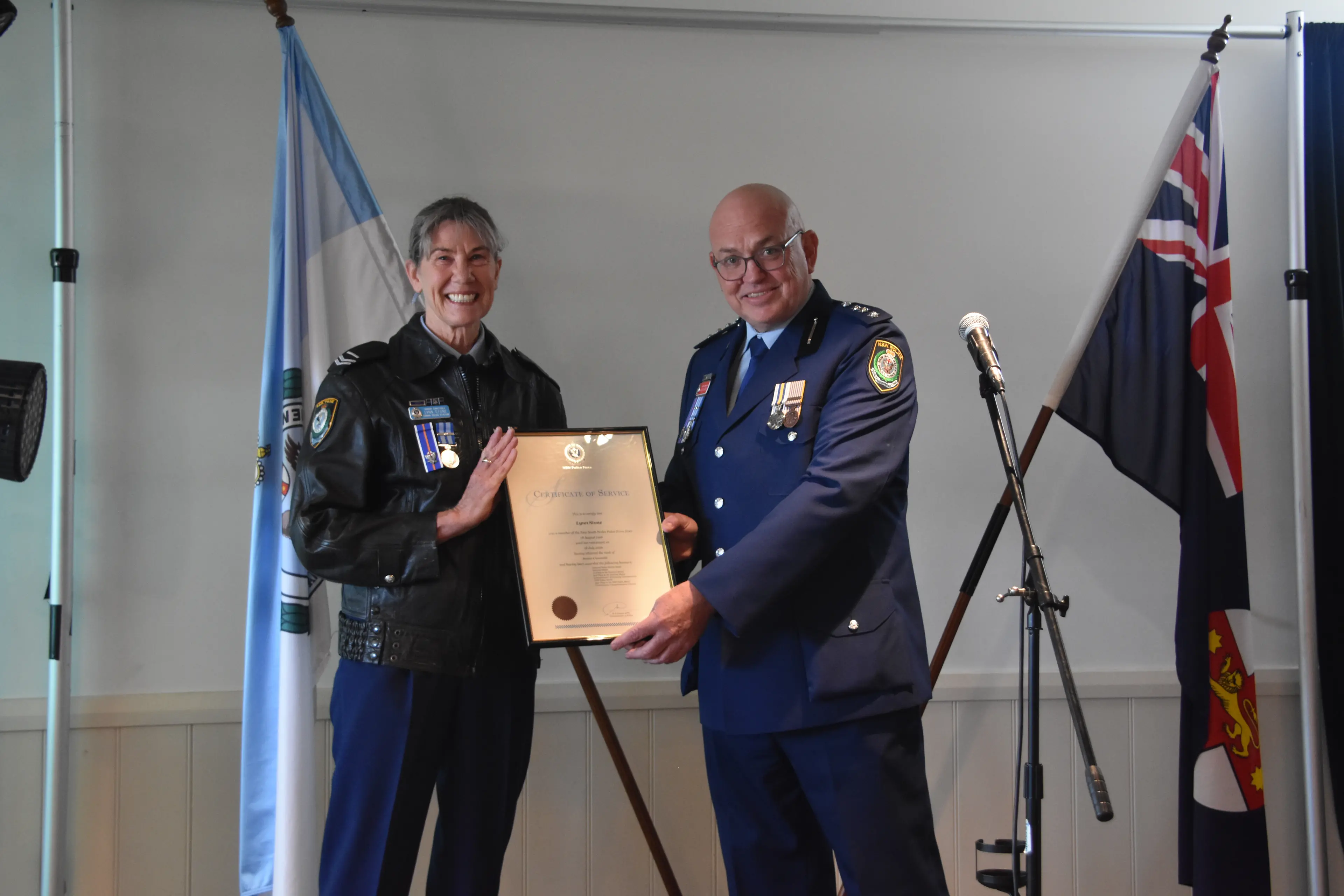<p>Senior Constable Lynn Stone receiving a Certificate of Service from Acting Superintendent, Jason Darcy, Acting Commander of Chifley District. PHOTO: Simone Sheridan</p>\\n