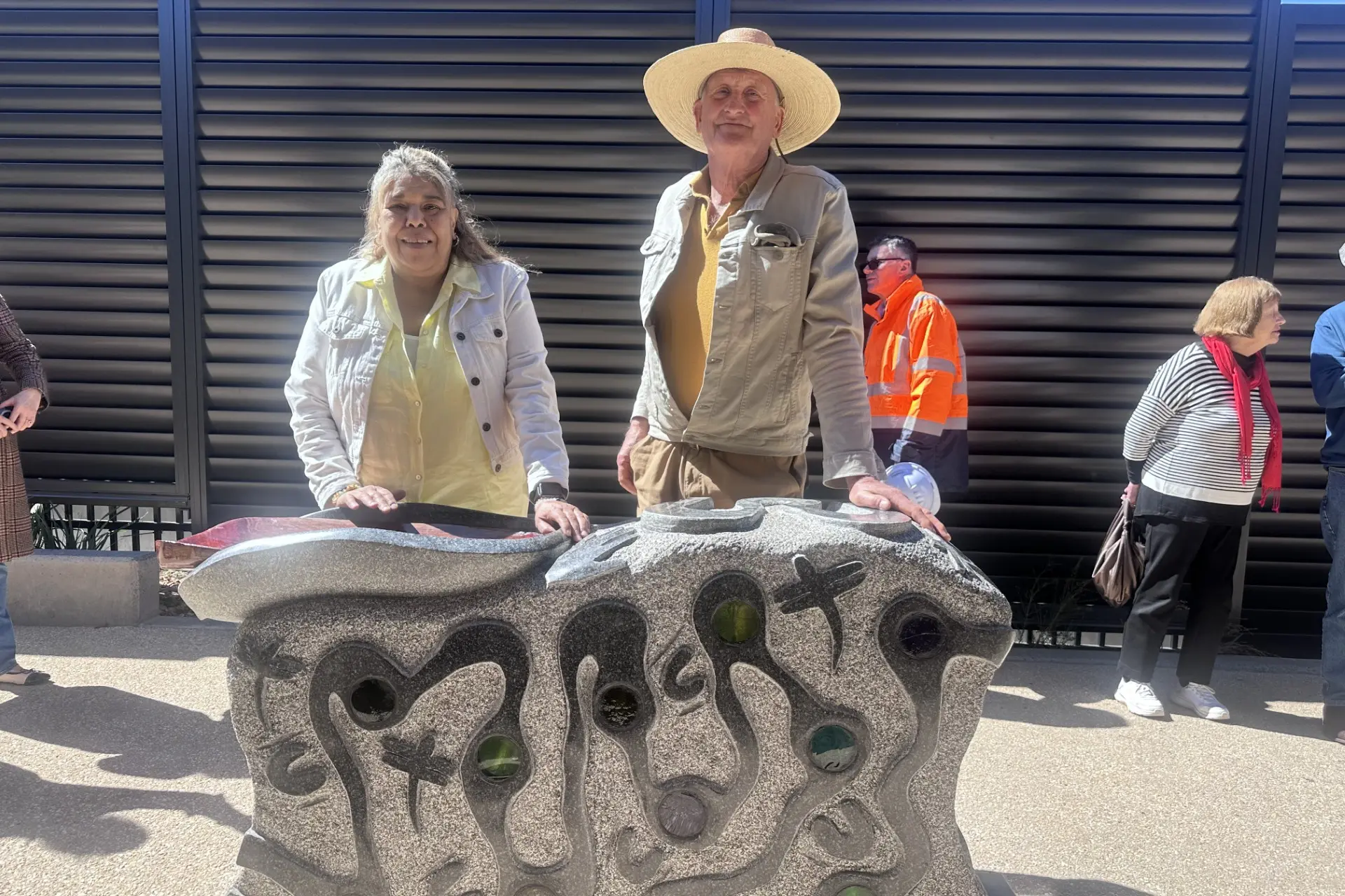 <p>Artists Diyan Coe and Ken Hutchison with their significant sculpture in the new Cowra Maternity Ward.</p>\\n