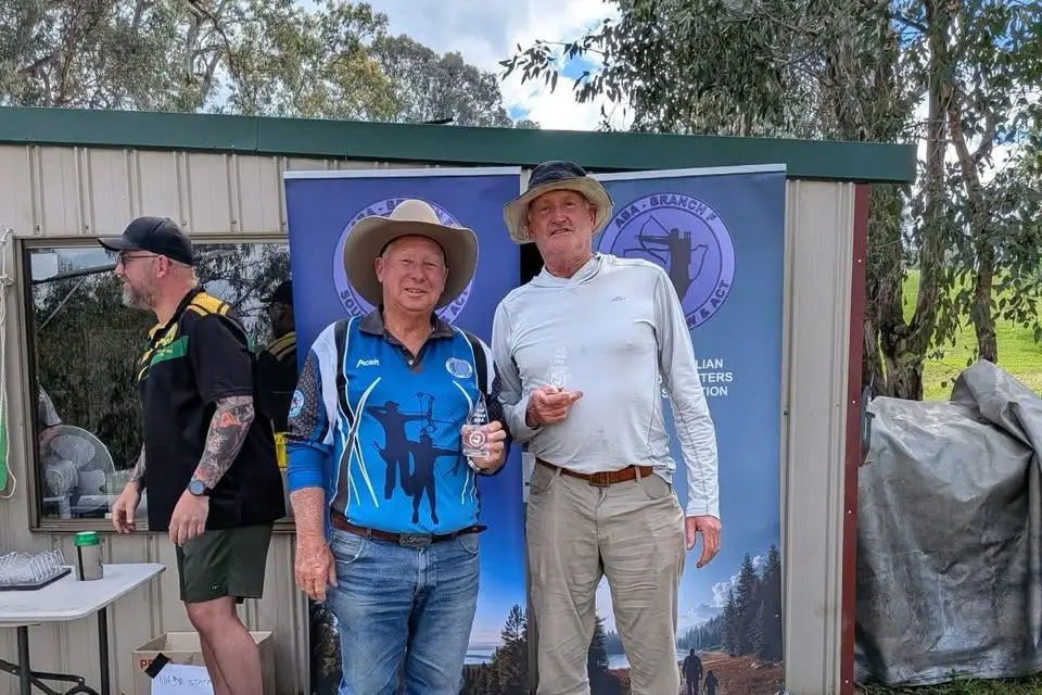 <p>New State AB Bowhunter recurve chmpion Ken Hutchinson (right) and Runner up John Collett with their state ABA trophies at Tumut.</p>\\n