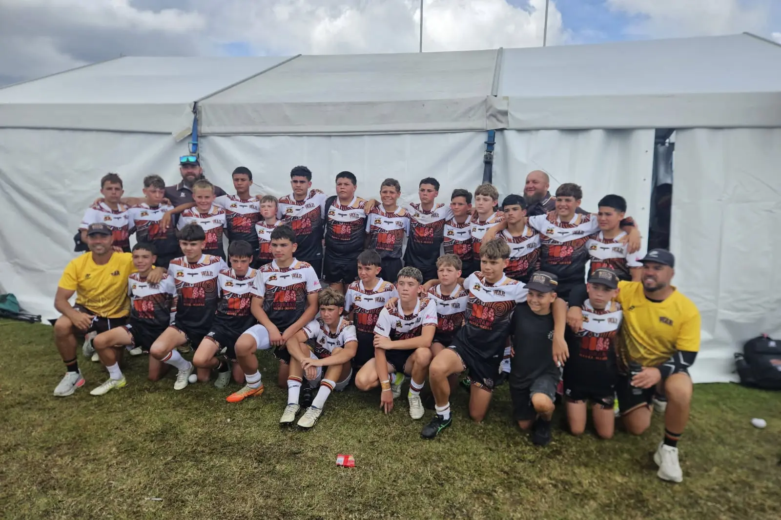 <p>Coach Will Ingram with the Under 13s team after their last game.</p>\\n